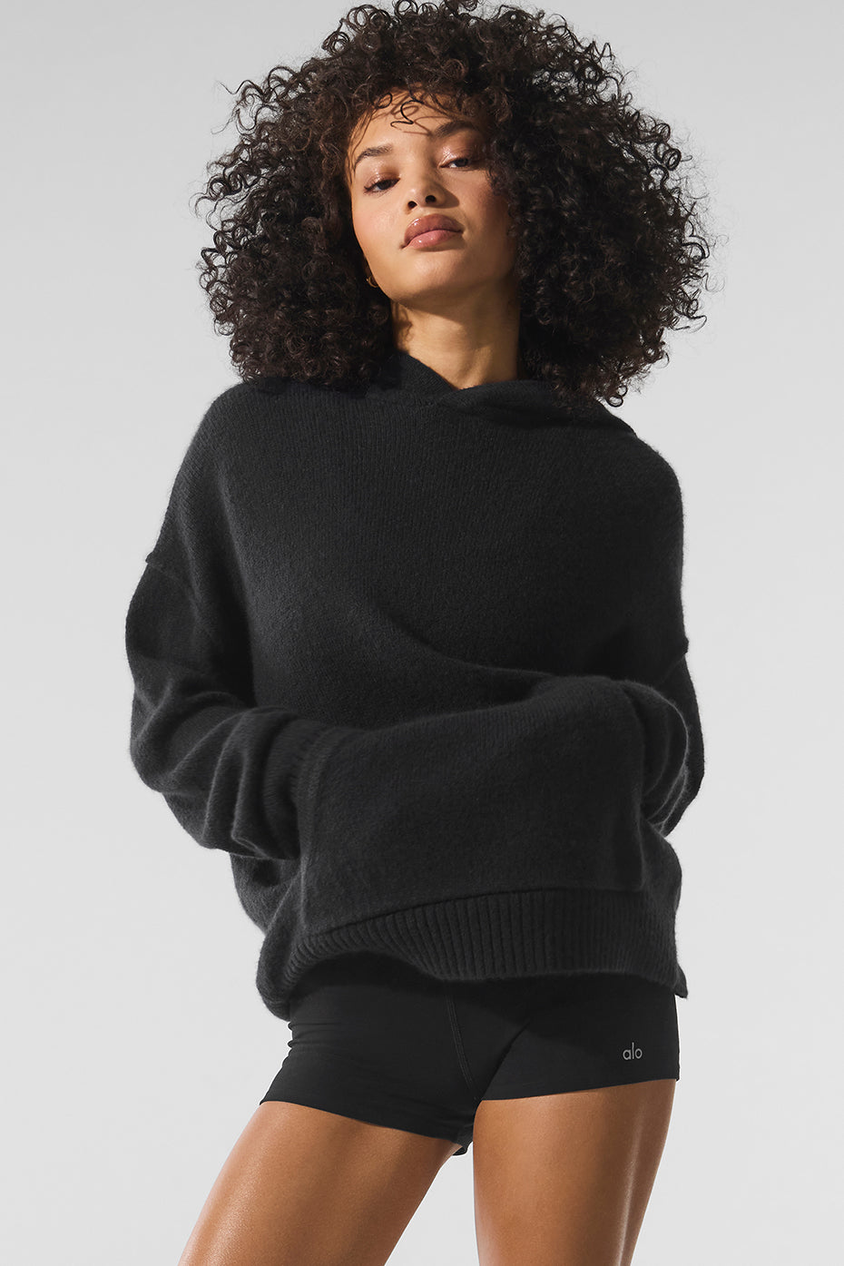 Front view of the black cashmere hoodie, showcasing its soft texture.