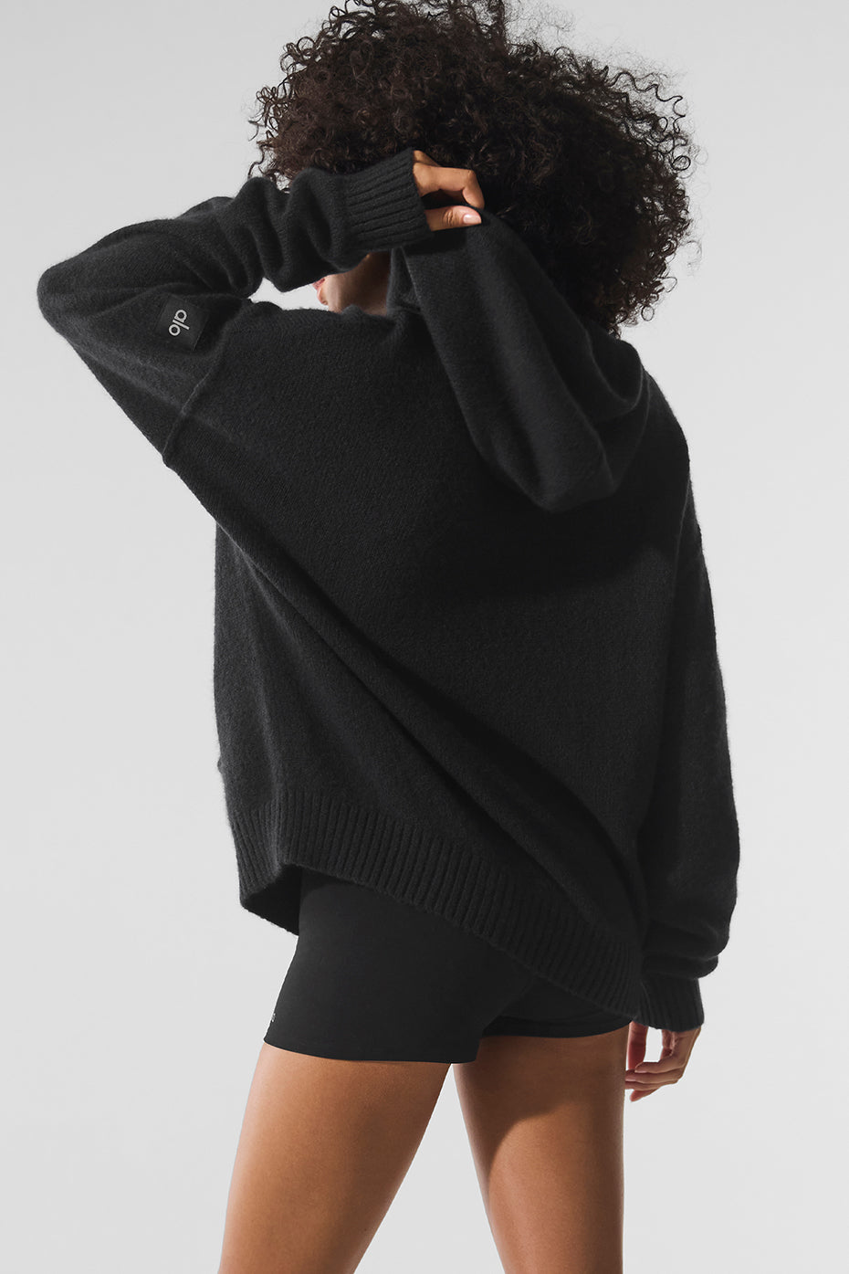 Back view of the ladies cashmere hoodie sweater, highlighting its elegant design.