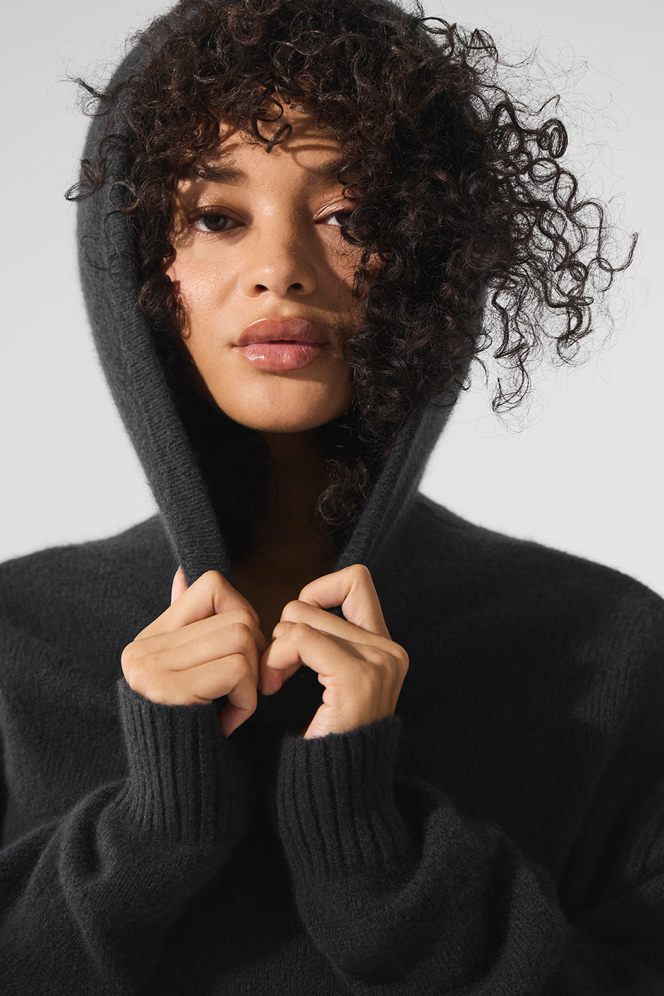 Front view of the black cashmere hoodie, showcasing its soft texture.