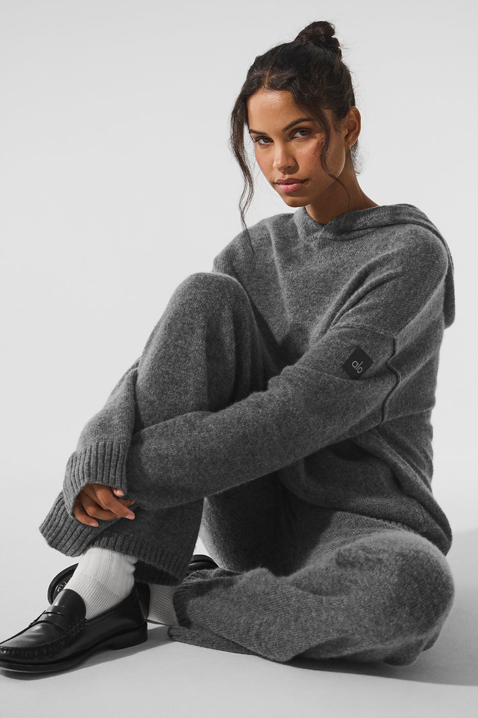 Front view of a cashmere zip hoodie with a sleek fit and soft texture