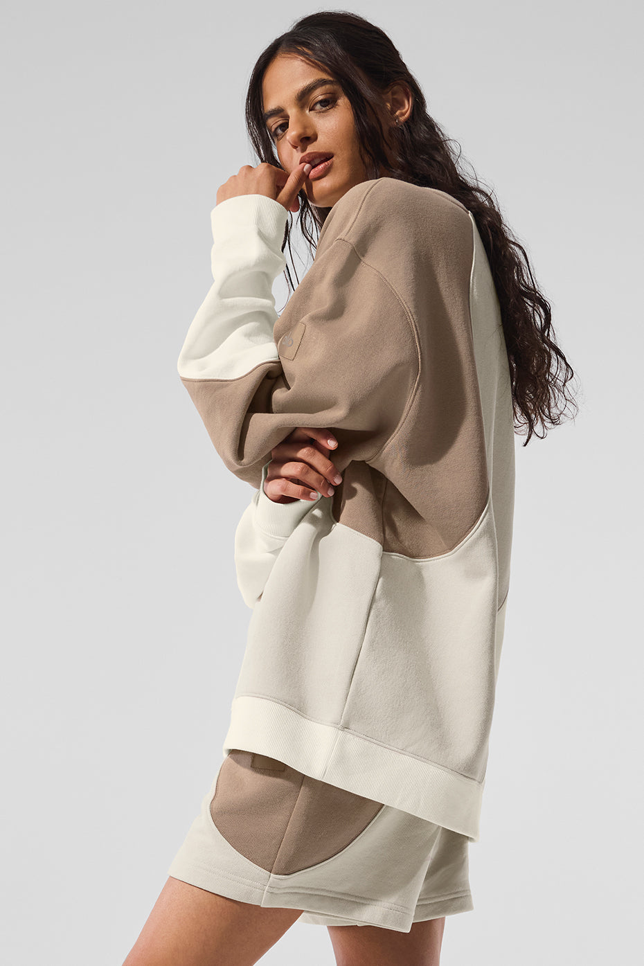 Model wearing the oversized sweatshirt with matching sweatpants for a relaxed look.