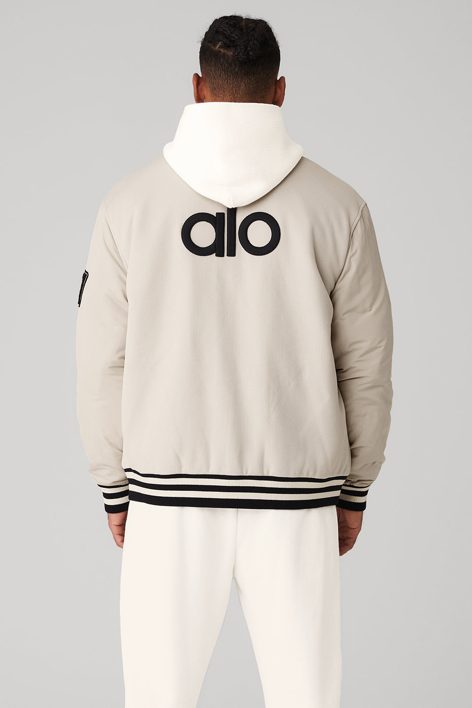 Side view showcasing unique patches on the fleece jacket.