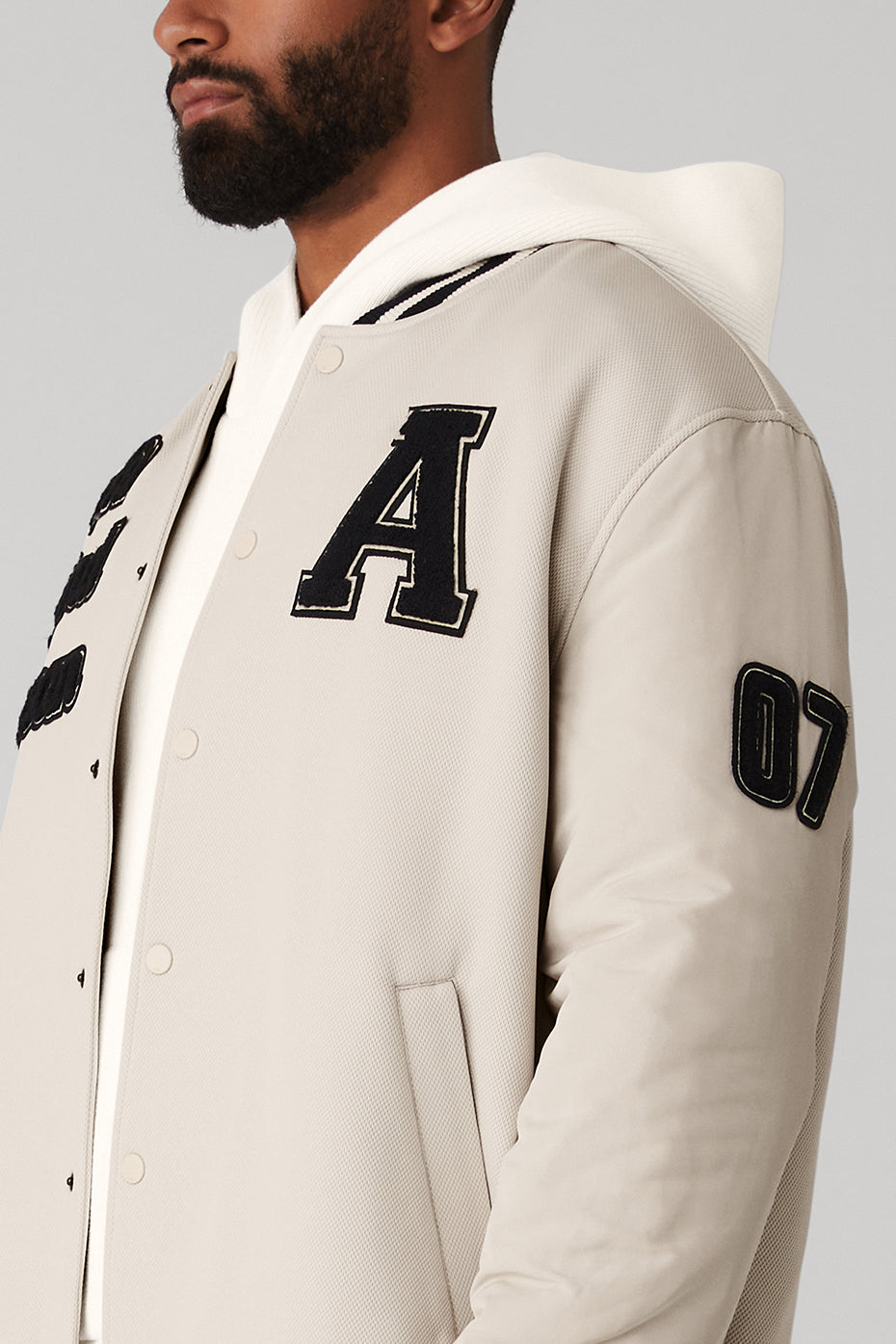 Front view of the Ultimate Letterman Fleece Jacket in bone color.