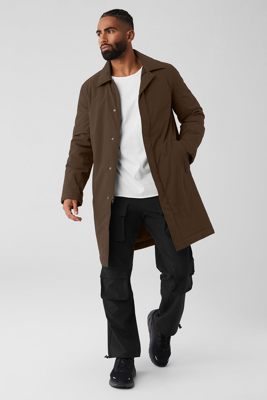 Model wearing the stylish men's wool overcoat in an urban setting, highlighting its water-resistant fabric.