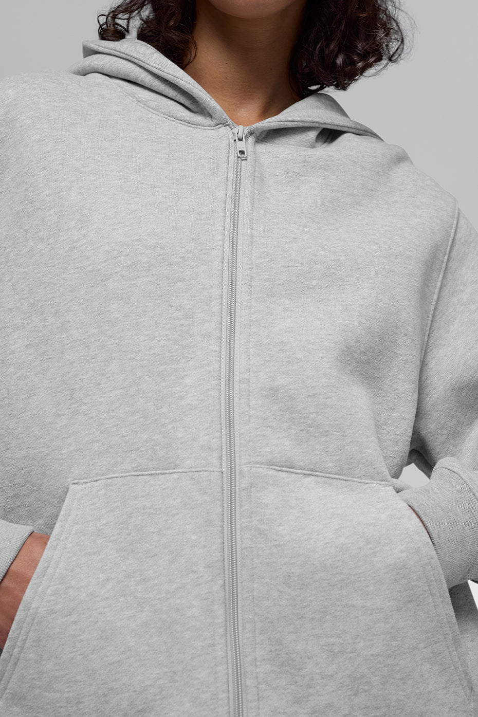 Side angle showing kangaroo pocket and athletic hoodie structure