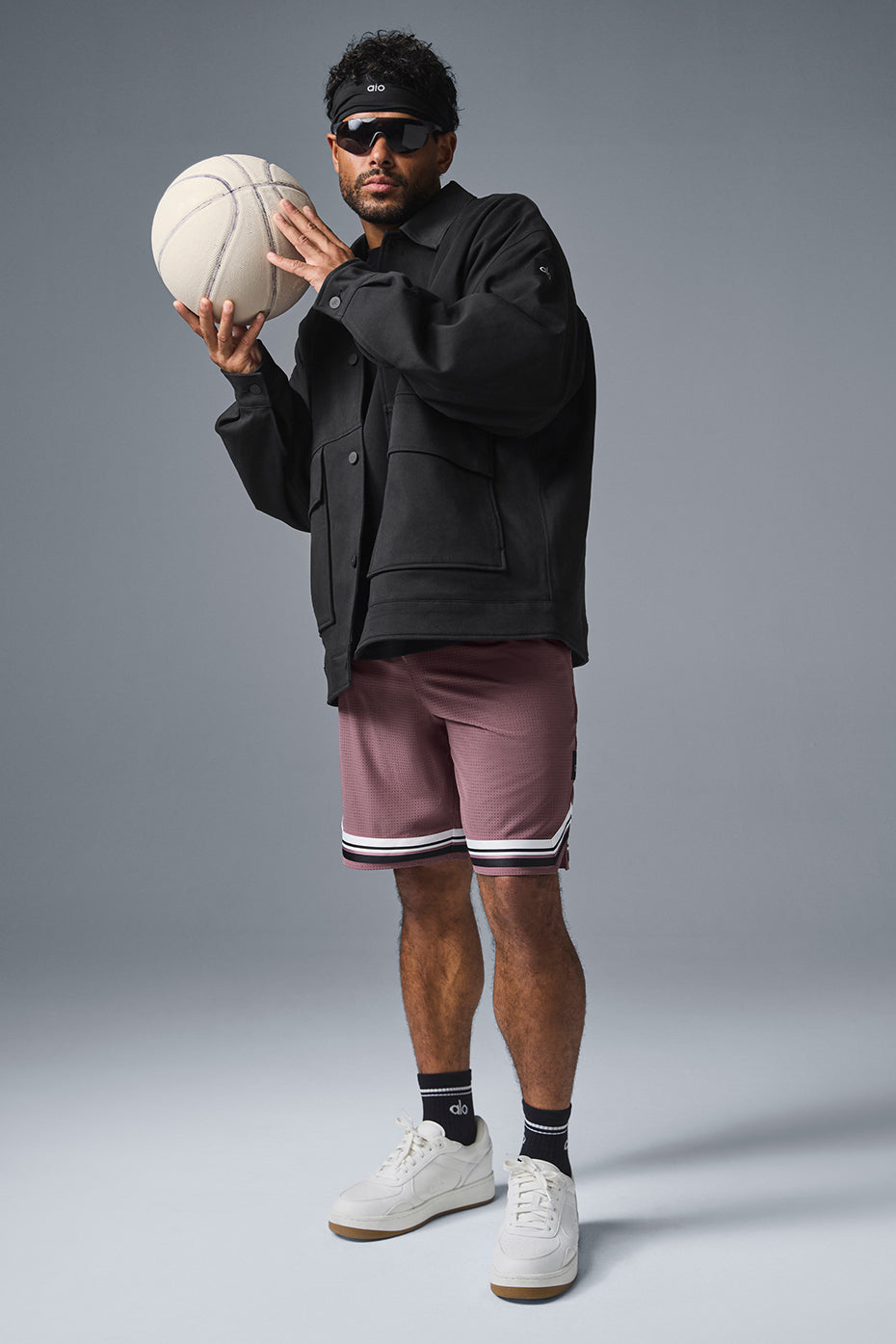 Front view of the black utility jacket showcasing its relaxed fit and oversized pockets.