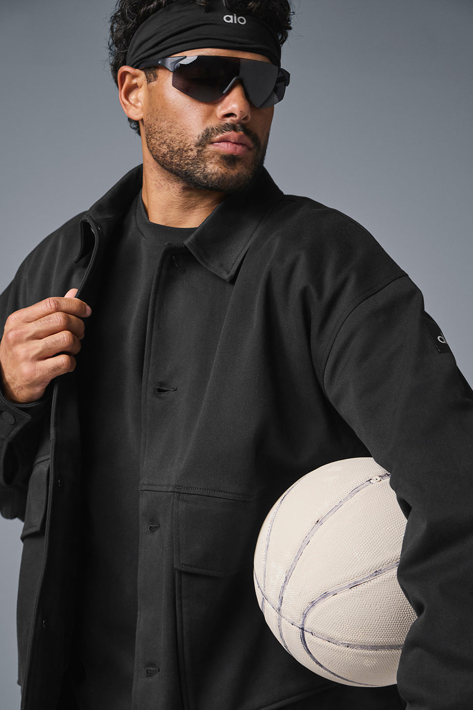 Side view of the unisex utility jacket, highlighting the matte buttons and collar.