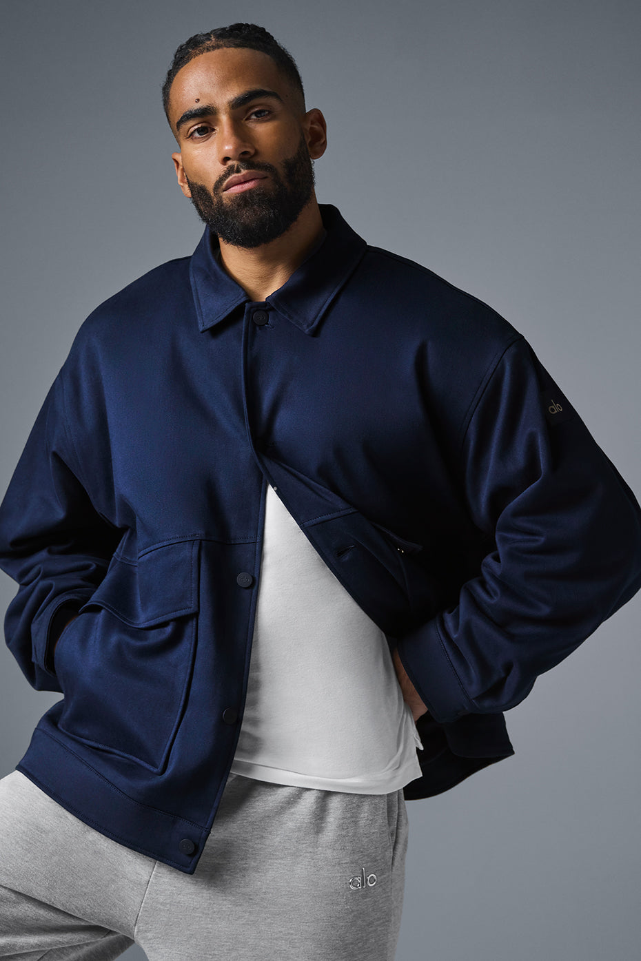 Front view of navy unisex utility jacket with oversized pockets
