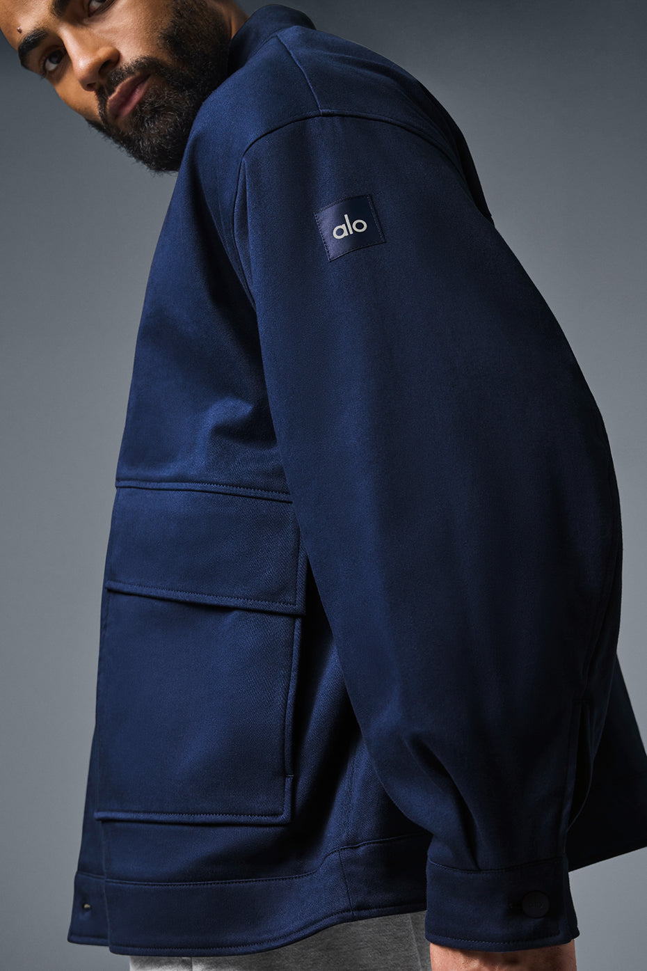 Model wearing the unisex utility jacket in a casual setting