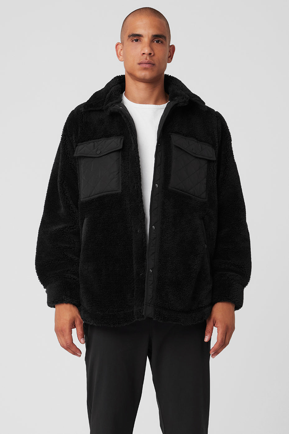 Front view of the black shacket showcasing its classic collar and cuffs.