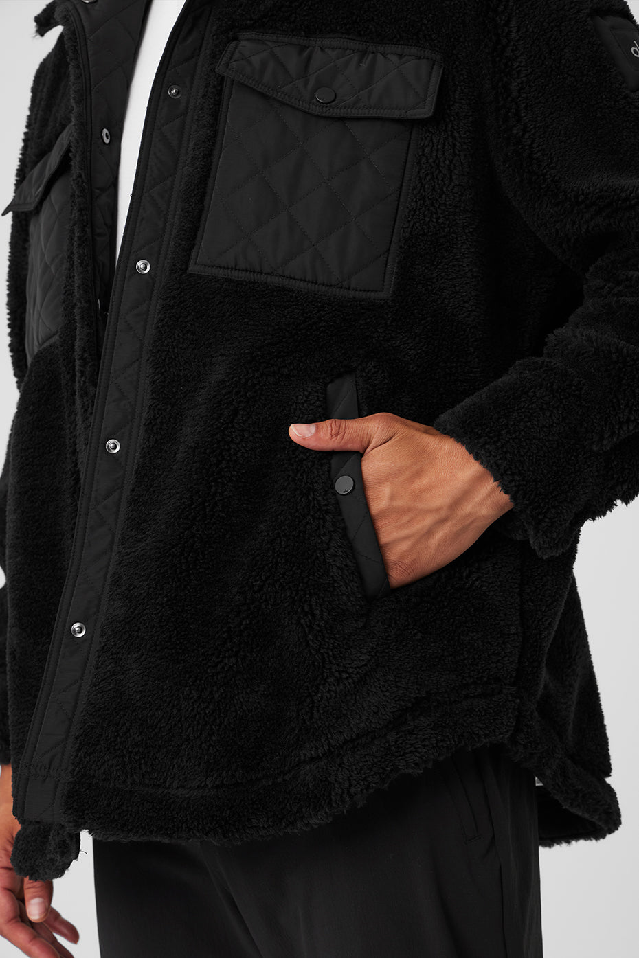 Front view of the black shacket showcasing its classic collar and cuffs.
