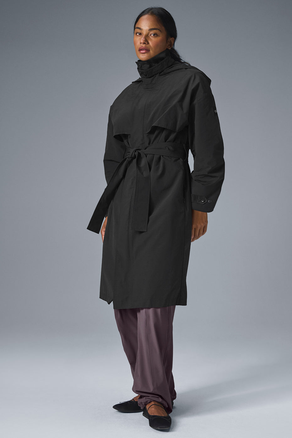 Close-up of a black trench coat collar with zipper detail