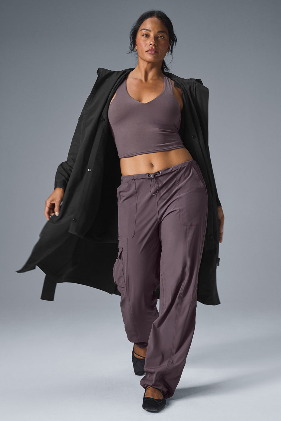 Full-length view of a woman showing the calf-grazing hem of the trench coat