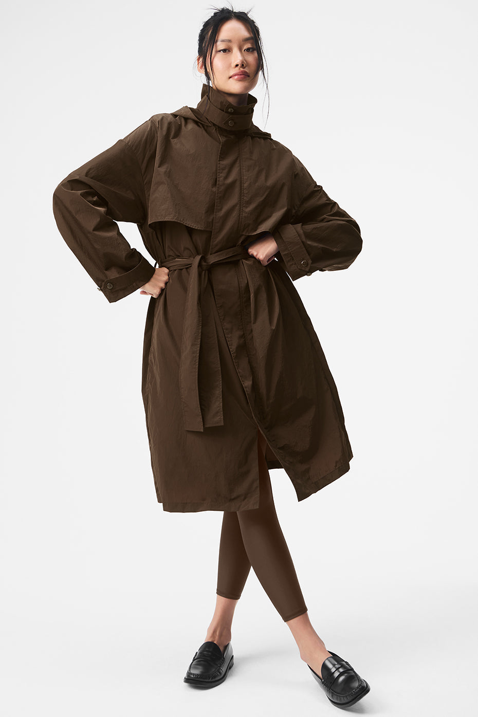 Model wearing trench&coat in urban setting, showcasing waterproof finish.