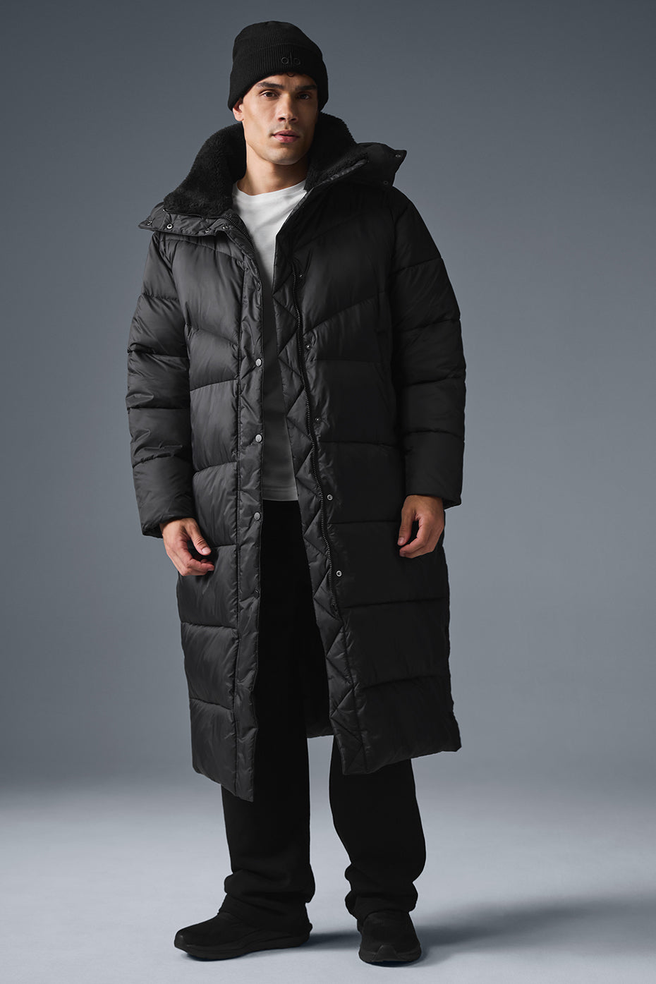 Front view of the Gold Rush oversized black puffer trench coat.