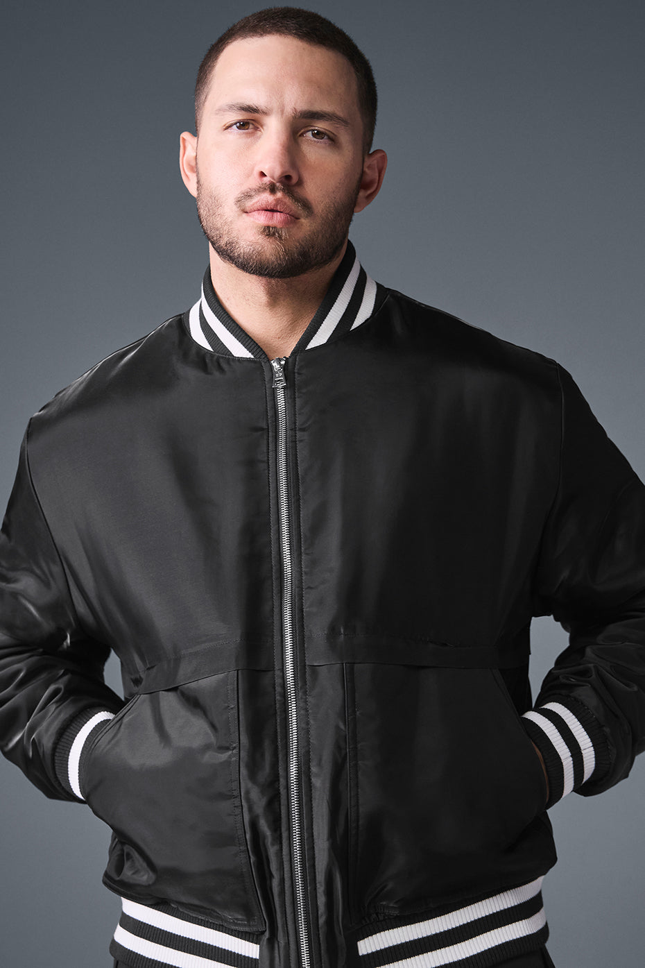 Model wearing the black bomber jacket, ideal for casual streetwear looks.