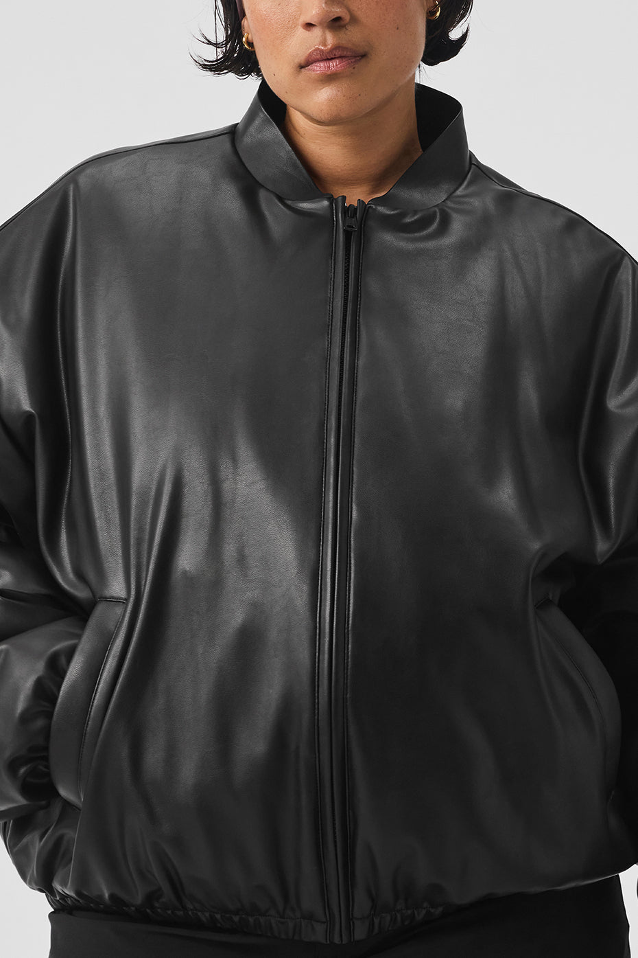 Model wearing the womens bomber jacket in a casual outdoor setting, perfect for cool weather.