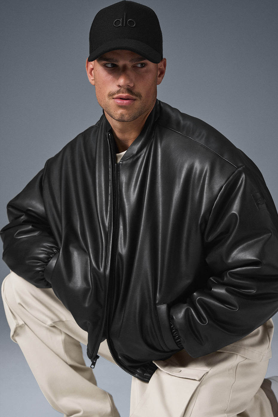 Front view of the womens bomber jacket in luxe faux leather.