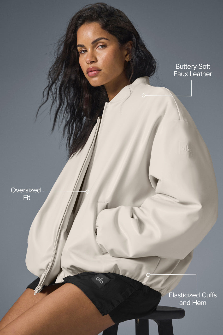 Side angle of faux leather jacket bomber showing puffed silhouette and smooth texture