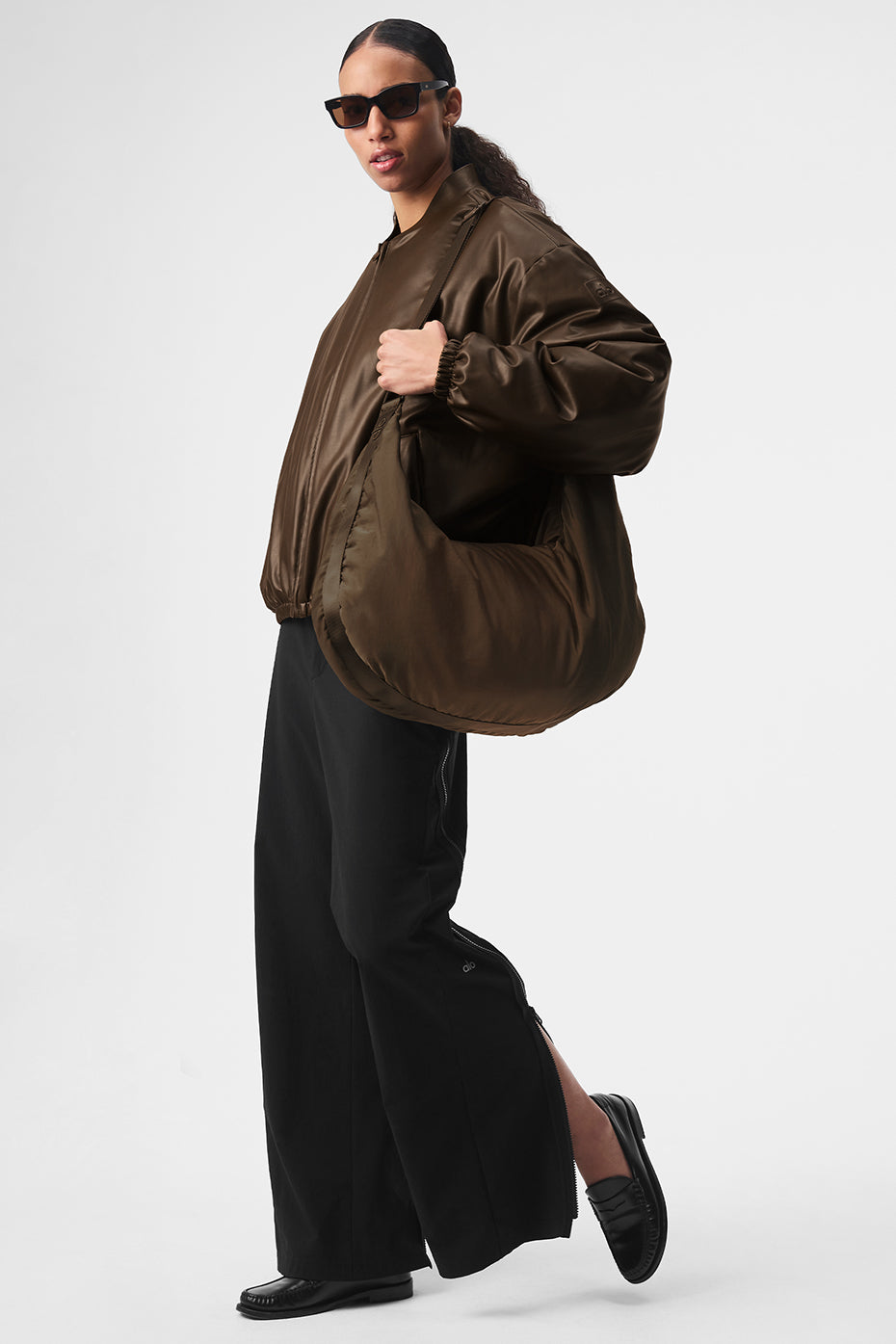 Model showcasing the faux bomber leather jacket, styled elegantly.