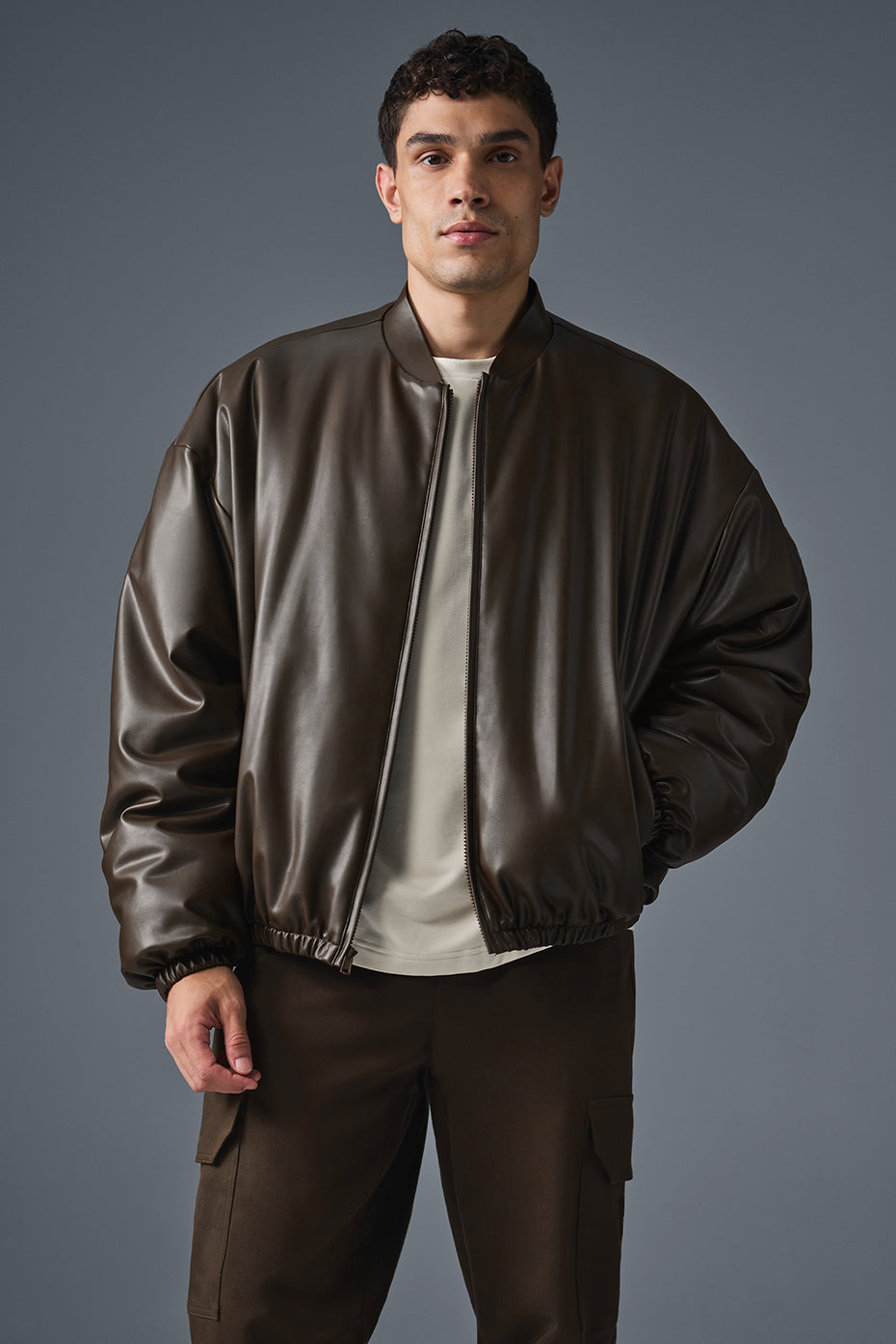 Close-up of espresso faux leather jacket texture and zipper detail