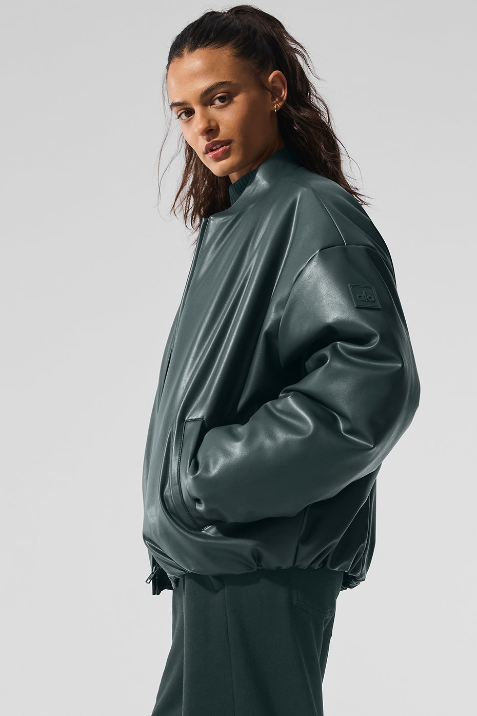 Back view showcasing the tailored fit of the women’s faux leather bomber