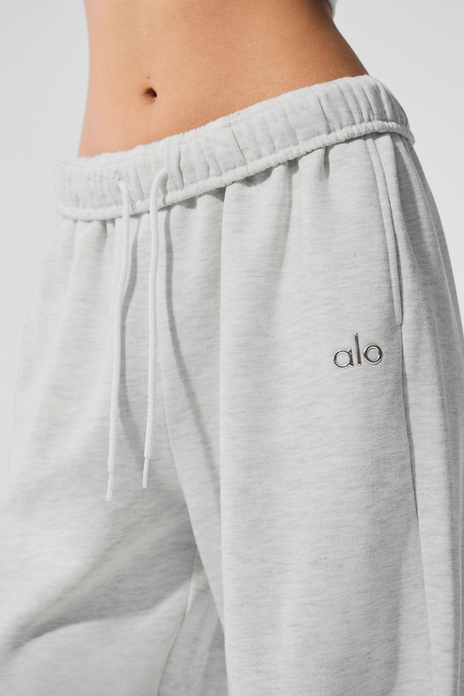 Model wearing Accolade straight-leg sweatpants styled with a jacket.