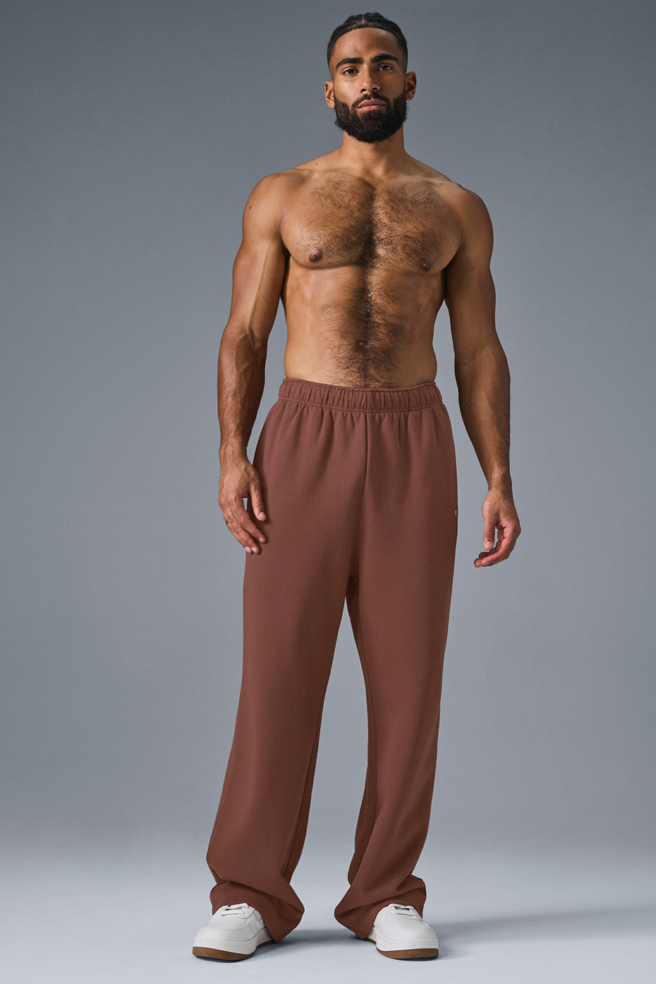 Close-up of the chrome ALO logo on Accolade Straight-Leg Sweatpants.