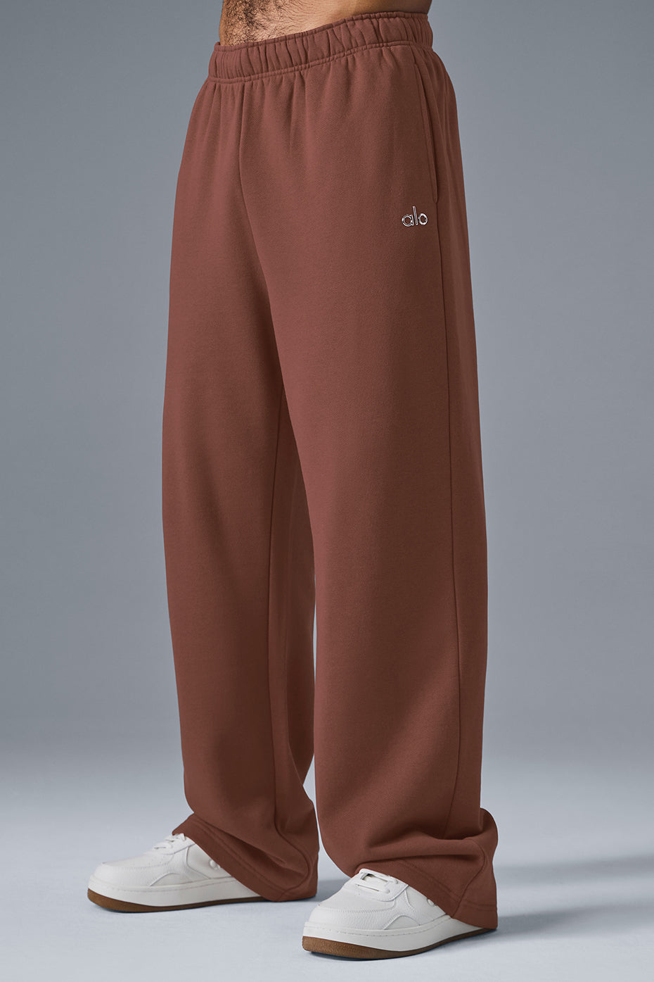 Model wearing baggy sweatpants in Chestnut, showcasing relaxed fit and style.
