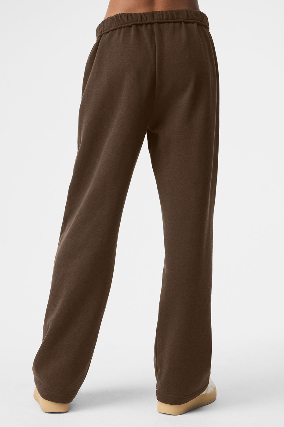 Close-up of grey sweatpants showing the Chrome ALO logo detail