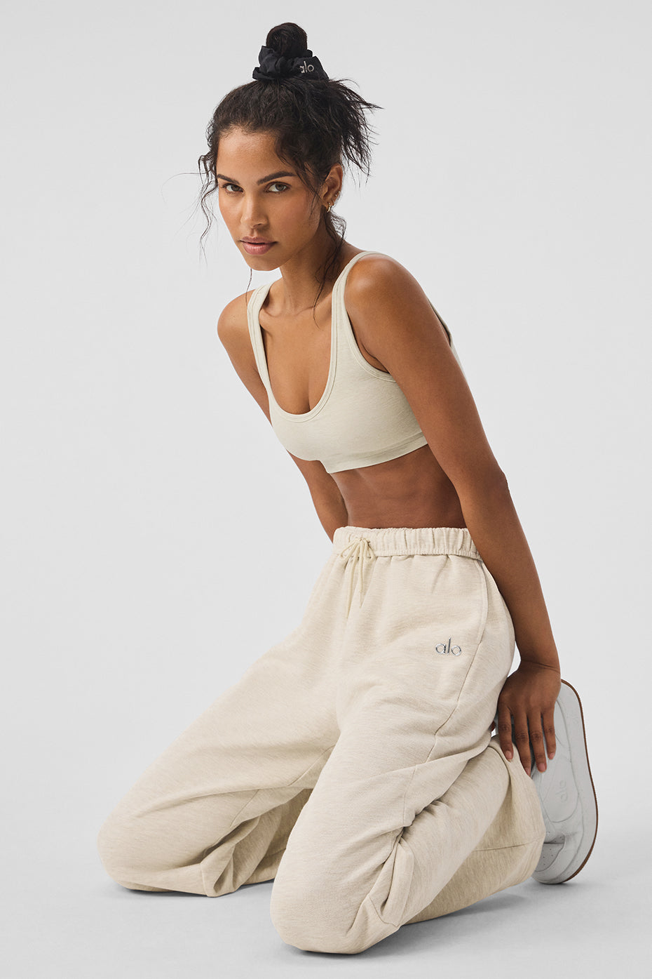 Model wearing Accolade sweatpants with a stylish jacket.