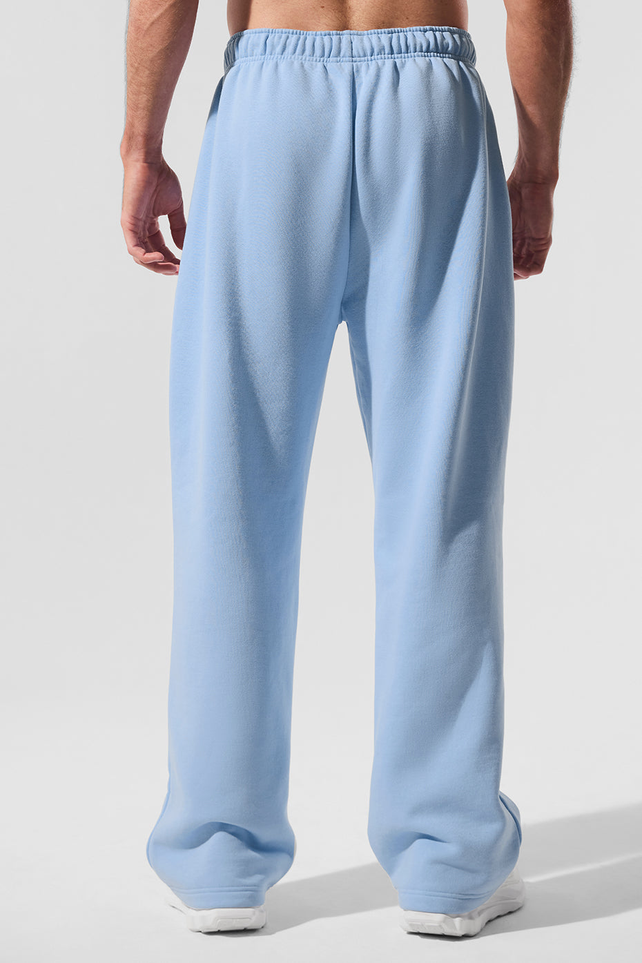 Model wearing Accolade sweatpants with a stylish jacket.