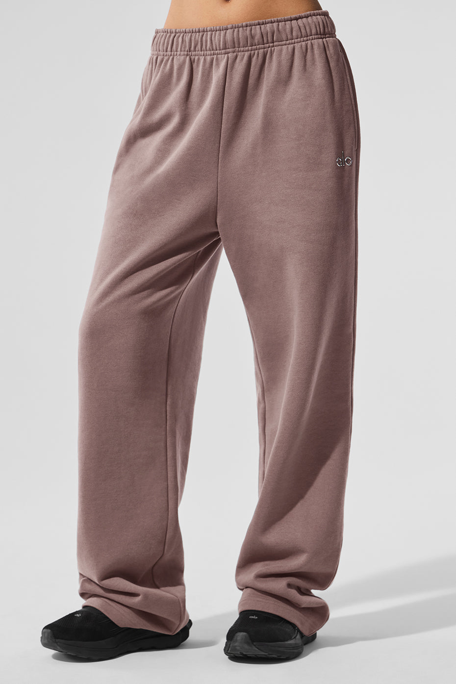 Front view of Accolade performance sweatpants in mushroom color, showcasing the chrome logo.
