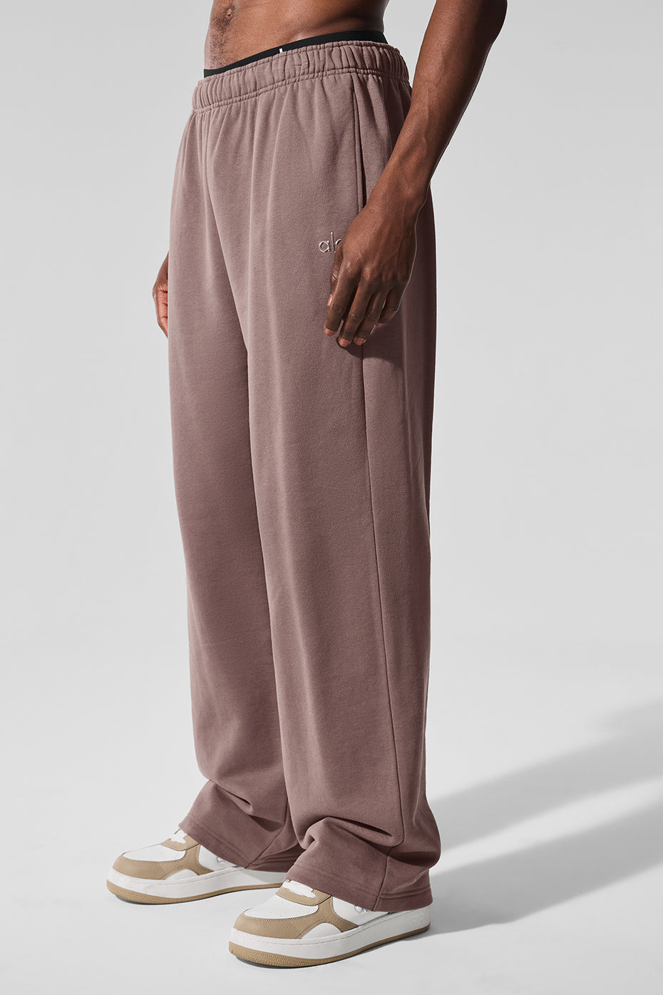 Model wearing Accolade Luxe Sweatpants in Mushroom, styled with a bold jacket.