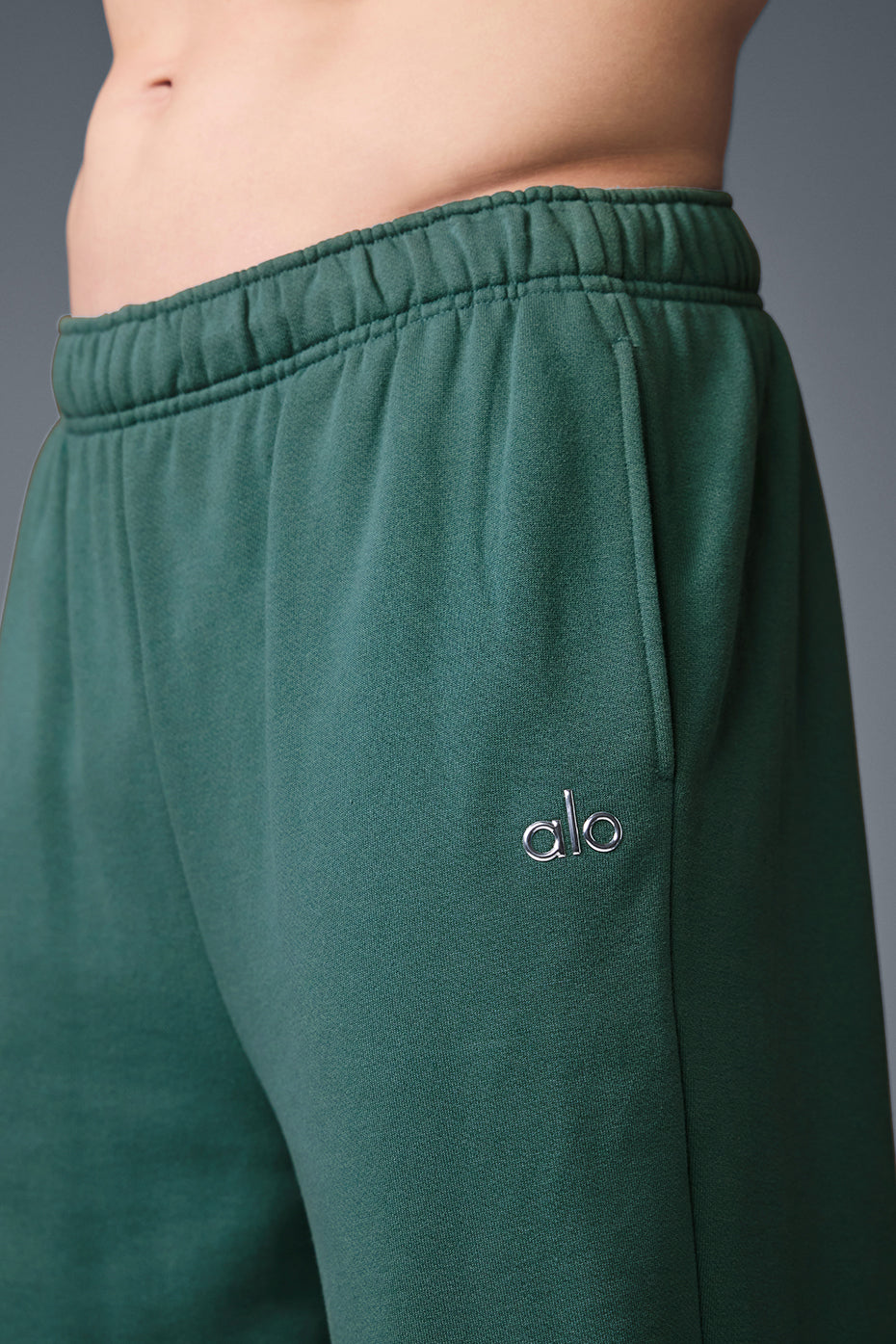 Front view of Accolade performance sweatpants in Winter Ivy, showcasing the straight-leg design.