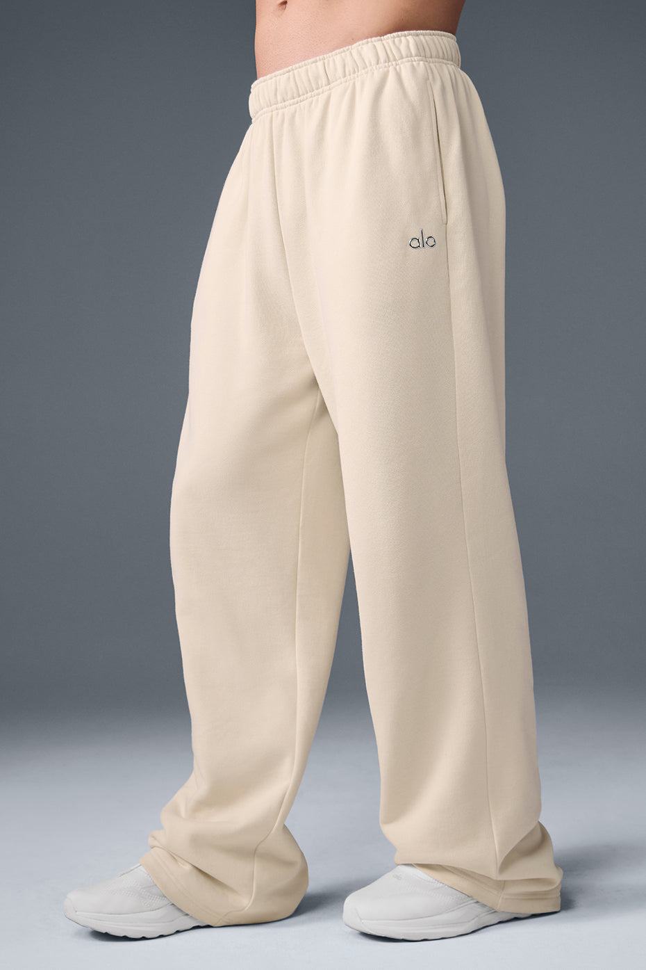Model wearing Accolade straight leg sweatpants with a bold jacket, perfect for cold weather.