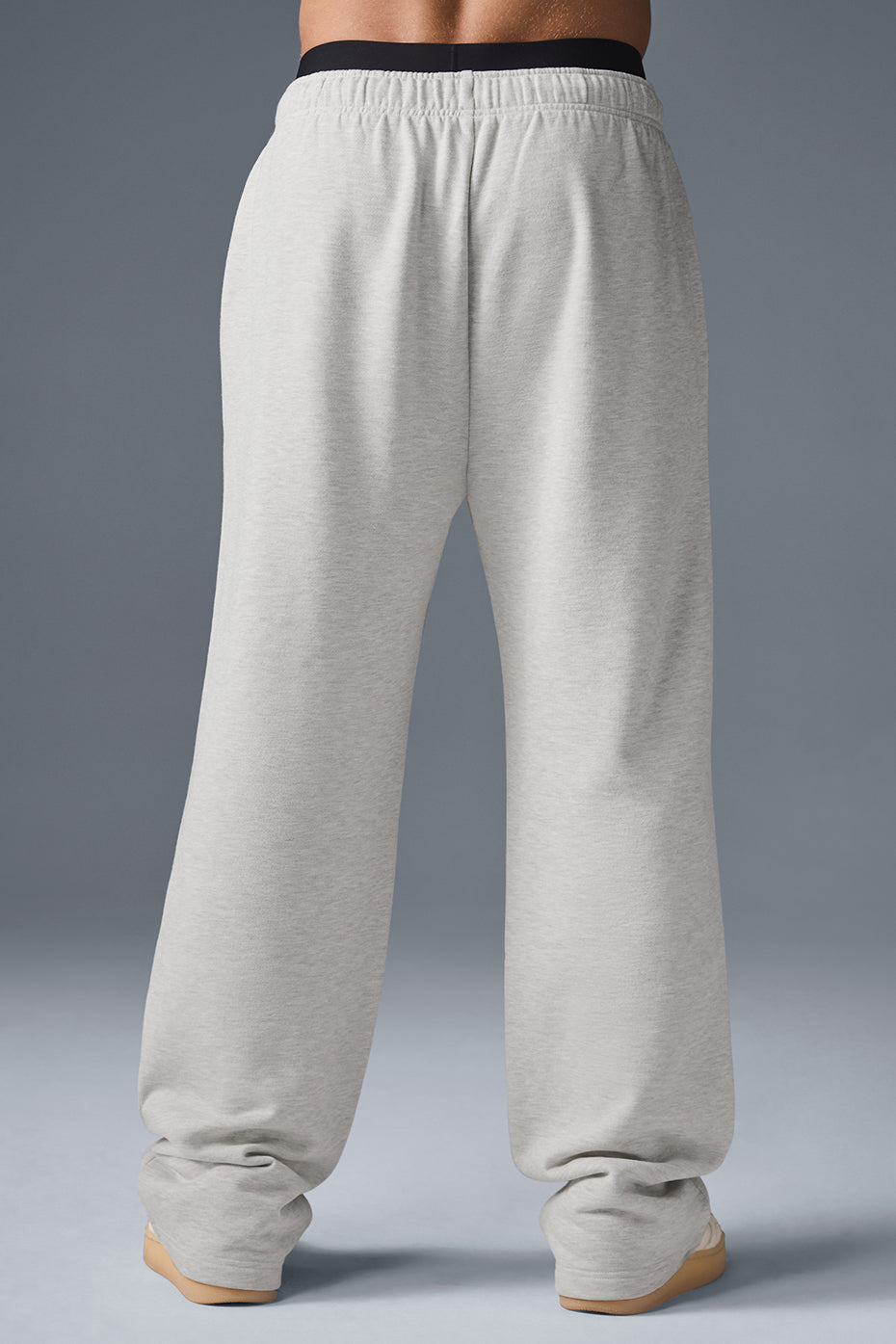 Casual scene with grey sweatpants and sneakers, perfect for streetwear