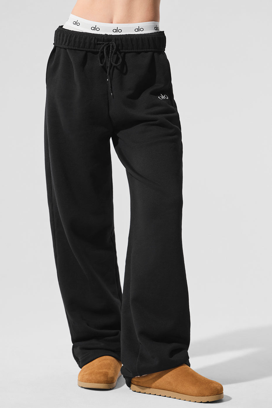 Model wearing Accolade wide leg sweatpants styled with a bold jacket.