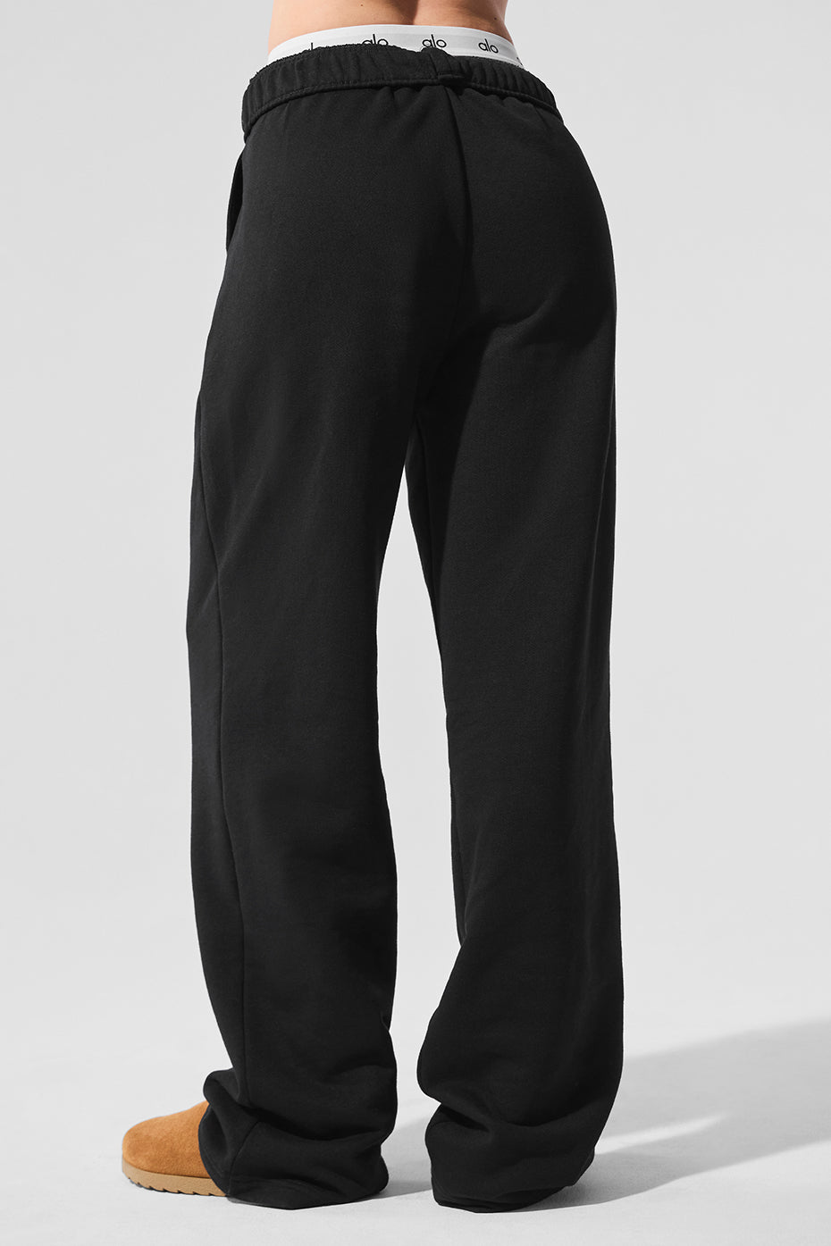 Casual look featuring Accolade black sweatpants with slides.