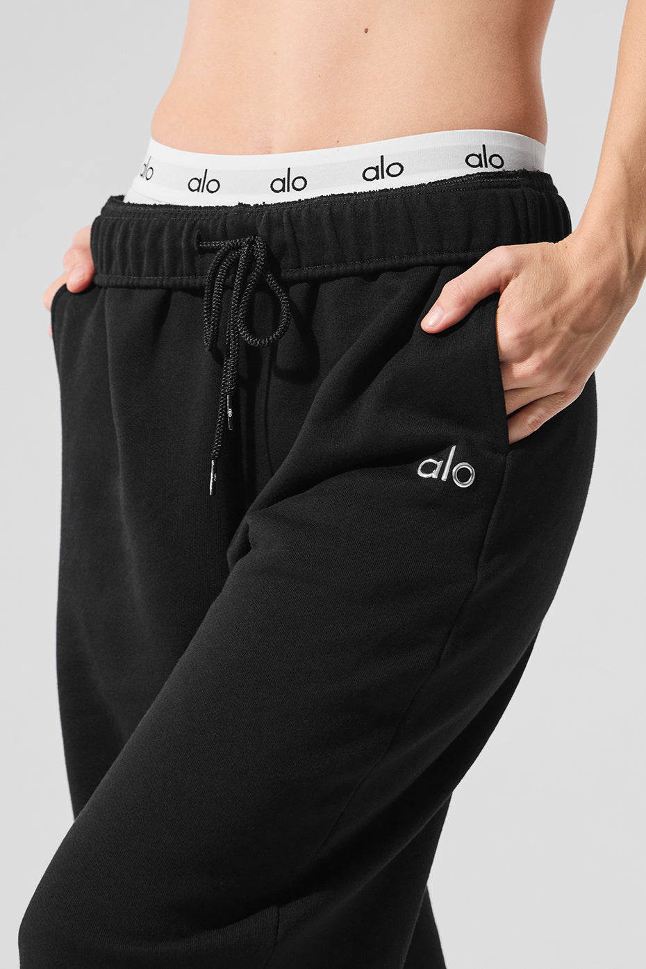 Model wearing Accolade wide leg sweatpants styled with a bold jacket.