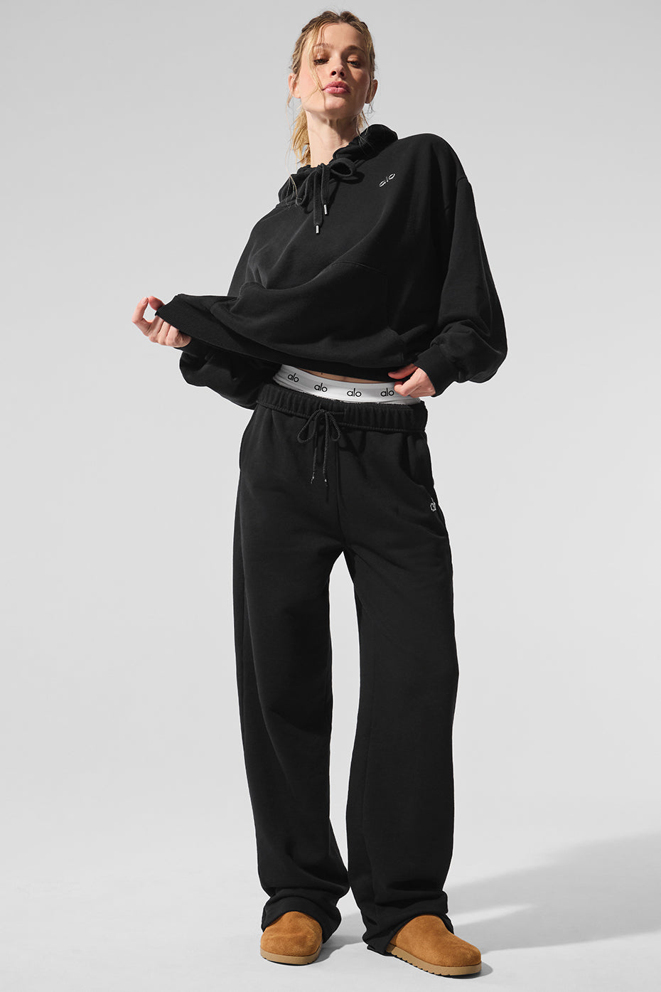 Casual look featuring Accolade black sweatpants with slides.