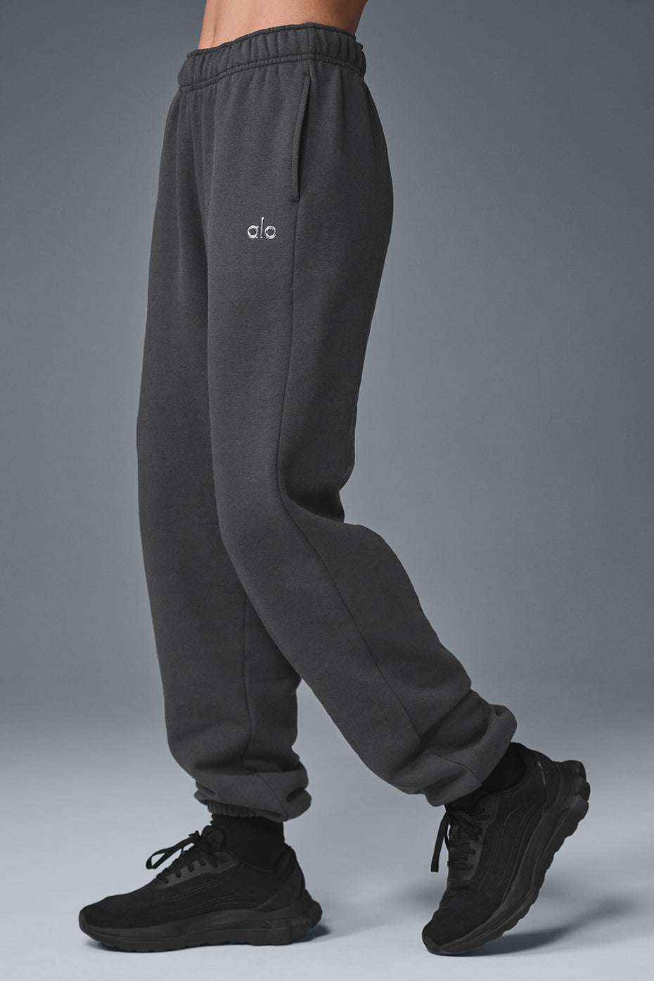 Model wearing Accolade sweatpants in anthracite, styled with a matching hoodie.