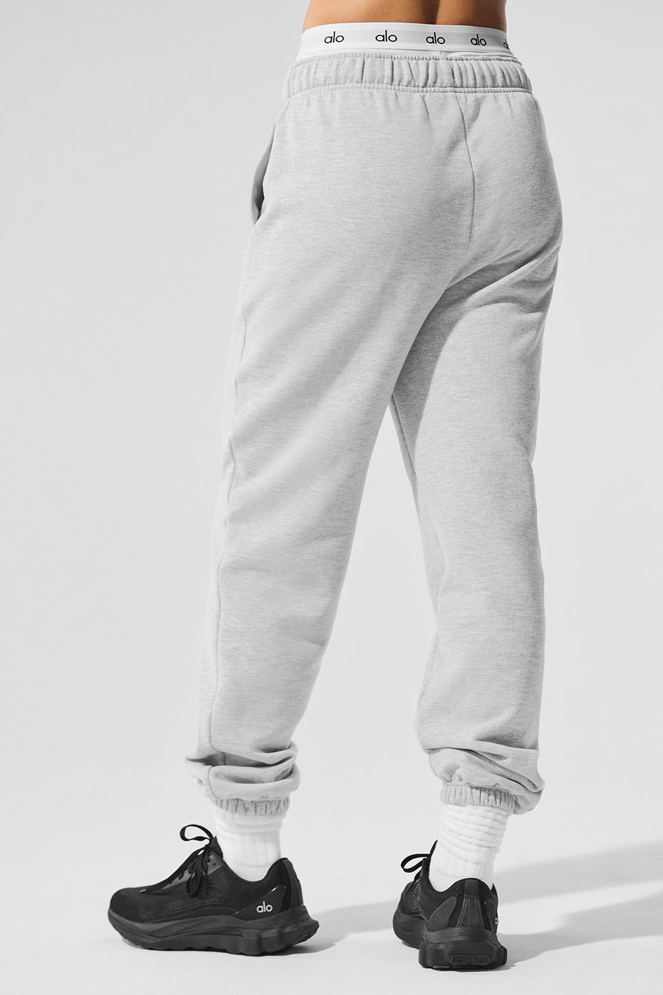 Side view showcasing the relaxed fit of grey sweatpants, ideal for athletic wear.