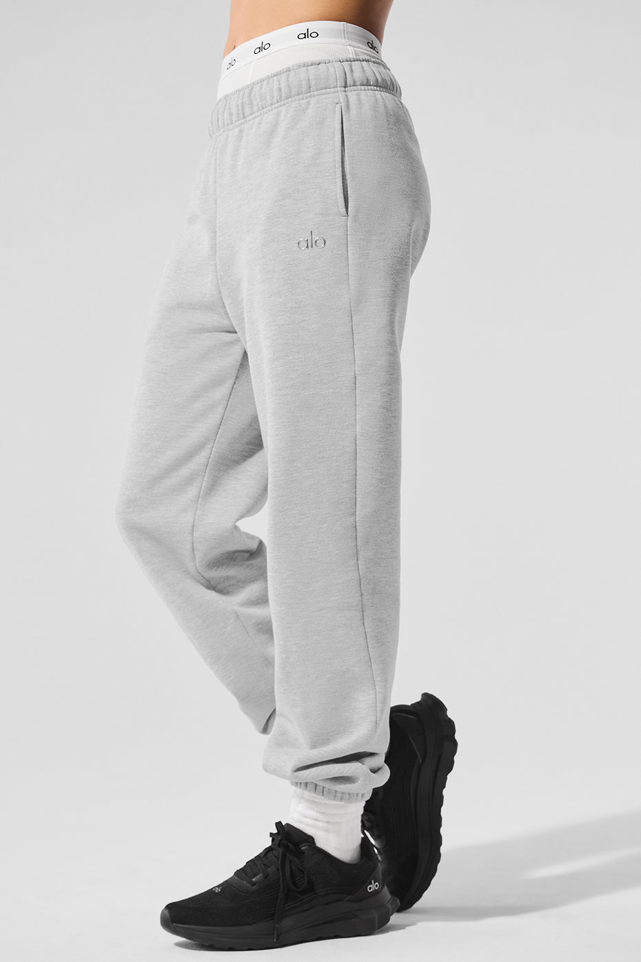 Close-up of the elastic waistband and cuffs of the wide leg sweatpants.