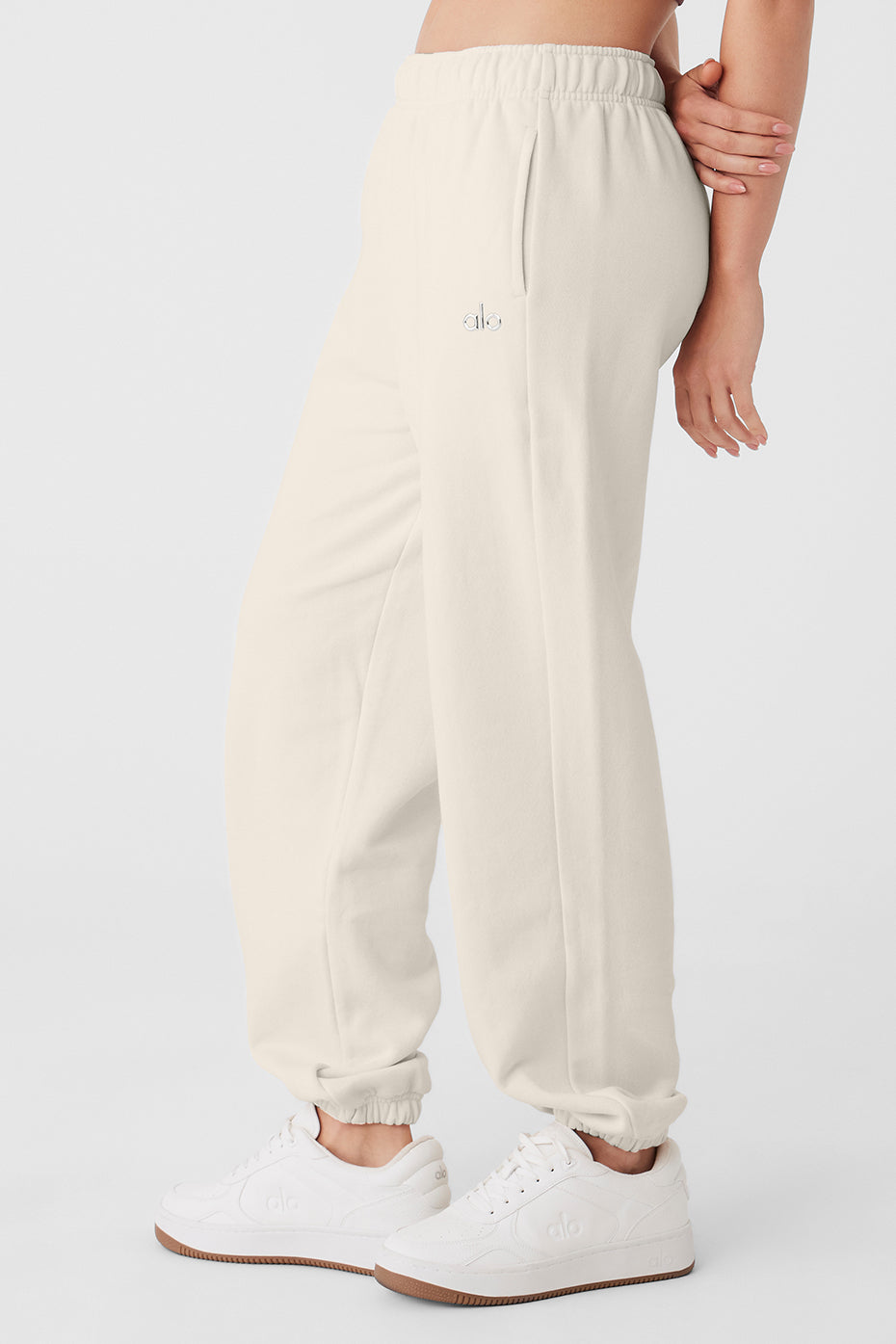 Model wearing Accolade sweatpants styled with a hoodie for an athleisure look