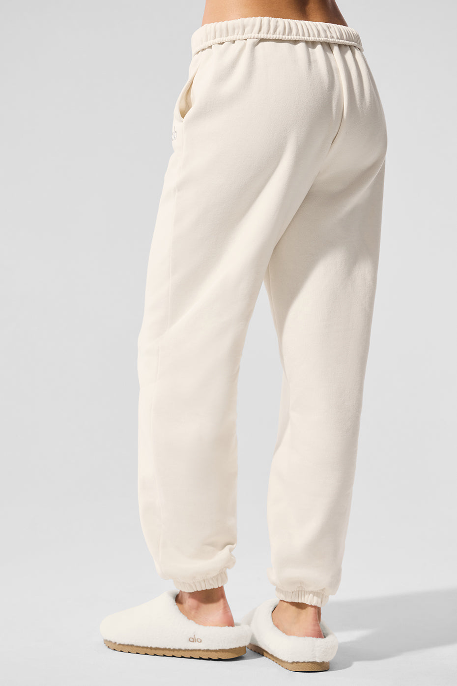 Wide leg sweatpants shown in an outdoor urban setting for versatility.