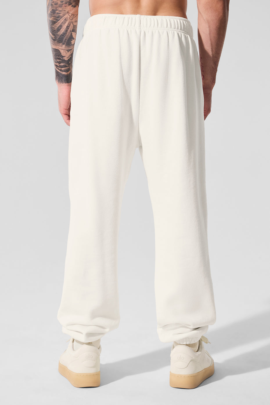 Model wearing baggy sweatpants paired with a hoodie for street style
