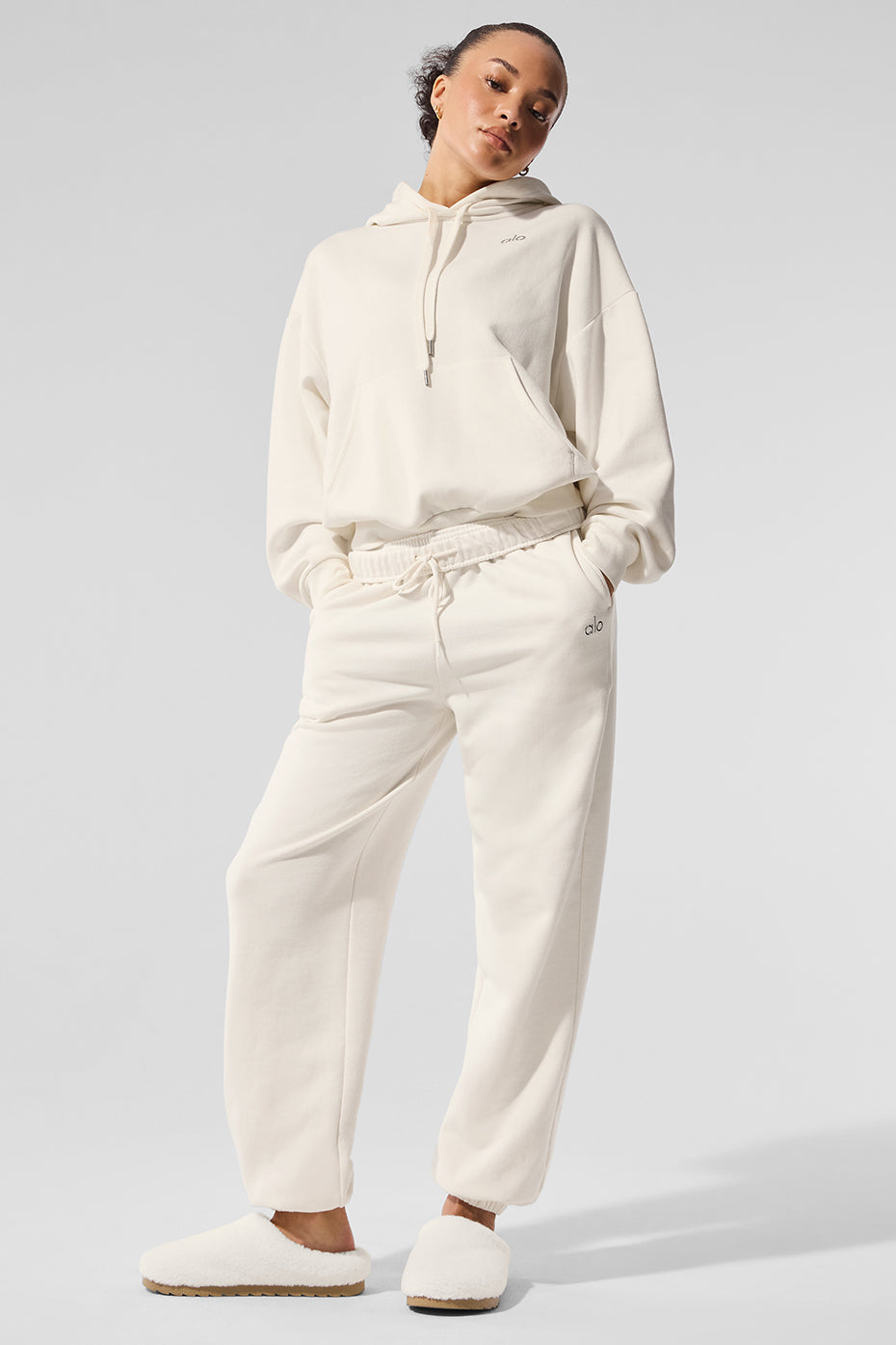 Wide leg sweatpants shown in an outdoor urban setting for versatility.