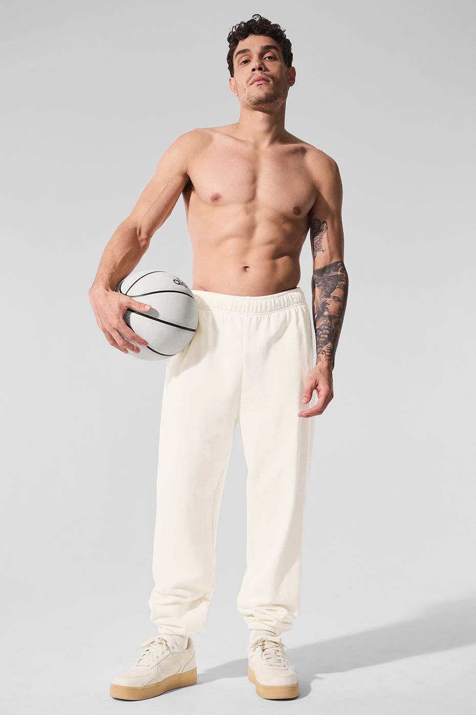 Model wearing baggy sweatpants paired with a hoodie for street style
