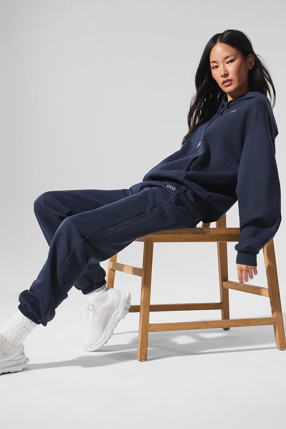 Front view of navy blue unisex sweatpants with elastic waistband and cuffs